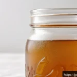 콤부차 가죽의 제조 과정 단계별 설명 - A close-up image of kombucha leather&rsquo;s unique gelatinous membrane texture, showing the translucent, ...